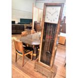 An Art Deco Longcase clock. Circa 1930. in a walnut veneered case. With two weights and a pendulum.