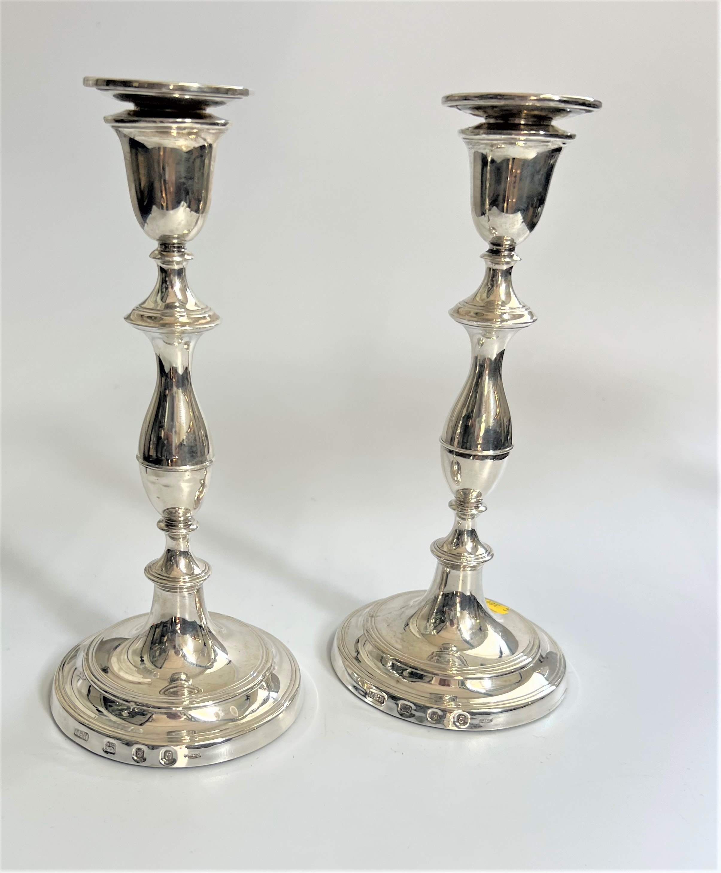 A Pair of Sterling Silver table candlesticks. Mills & Hersey. London 1979