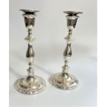 A Pair of Sterling Silver table candlesticks. Mills & Hersey. London 1979