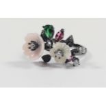 Silver and black rhodium ring with carved coloured acrylic flowers and red and white cubic zirconia,