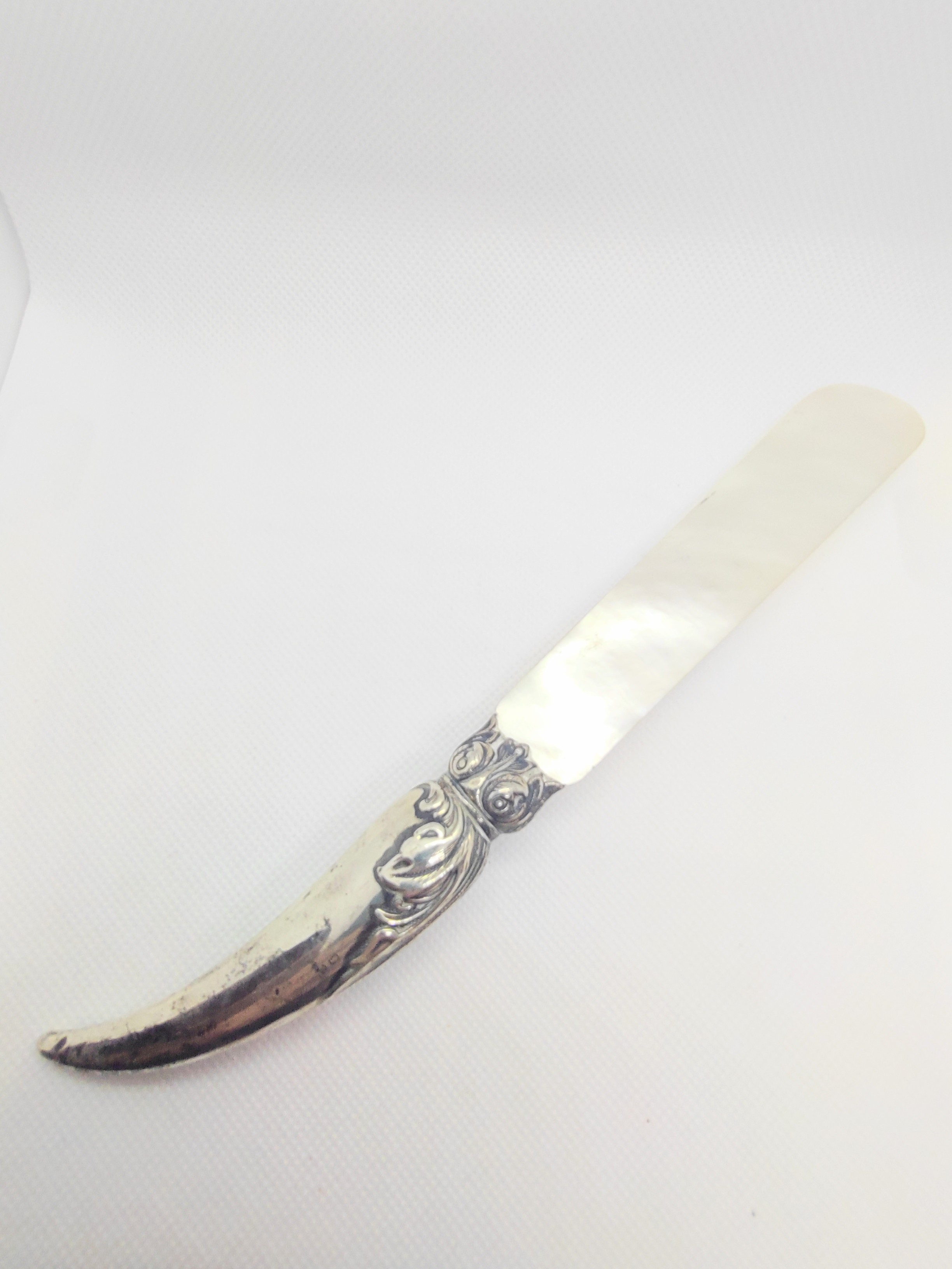 A sterling silver mounted and mother of pearl letter opener. Birmingham 1904.