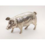 A German sterling silver model of a pig. Import marks. Circa 1900 with detachable head. 6cm high,