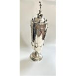 A George V sterling silver large trophy cup and cover, Omar Ramsden, with strap work decoration