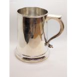A sterling silver pint mug, London 1965. Quite plain. 309gms.