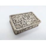 A Chinese cast silver snuff box. 19th century with Yatshing makers mark embossed with figures on