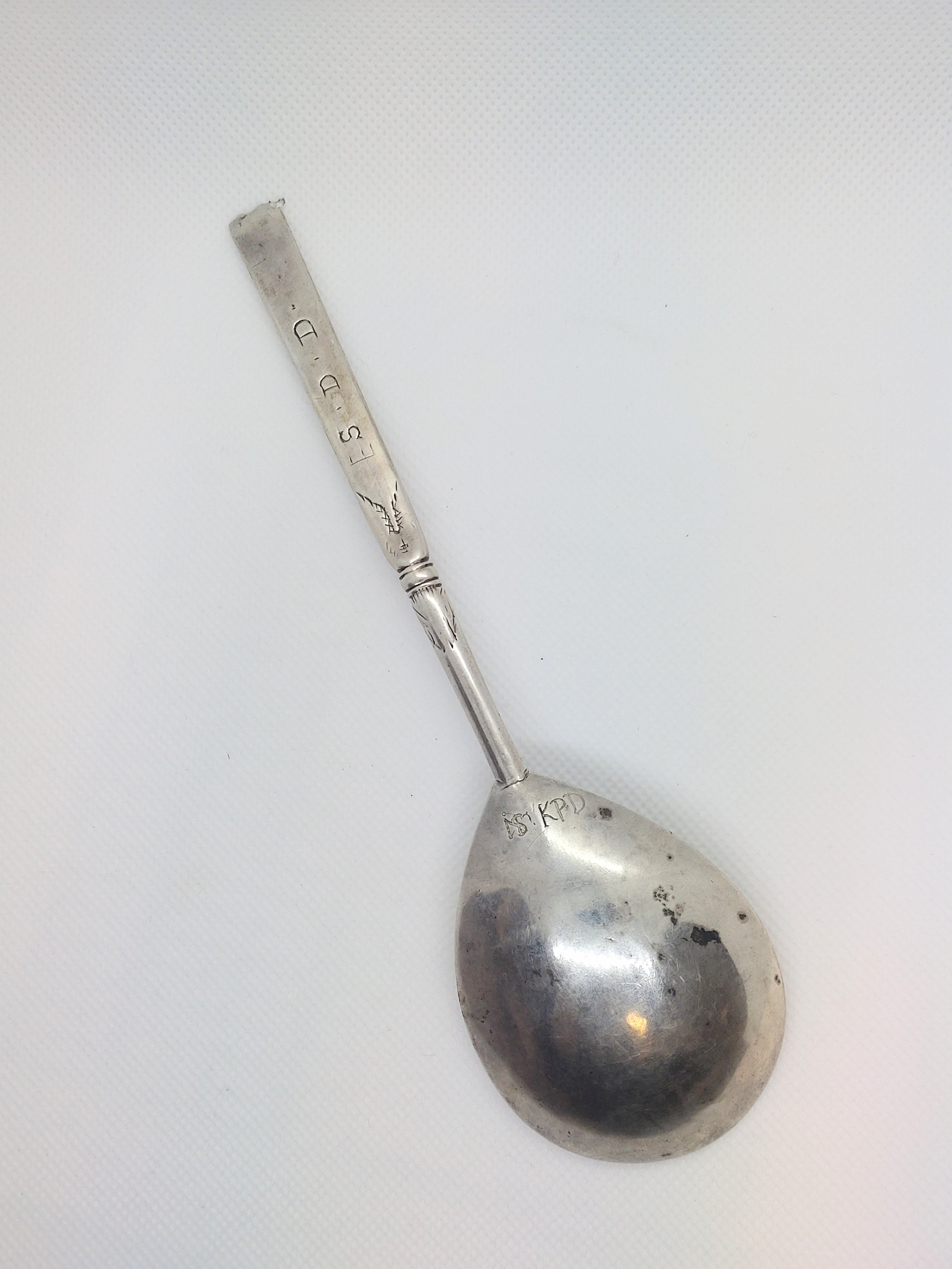 An 18th century Scandinavian silver spoon engraved with scrolling foliage and groups of initials. - Image 2 of 2