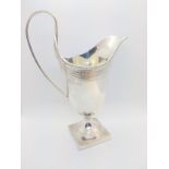 A modern sterling silver cream jug in George III style. London 1968. 107gms.