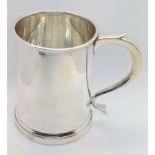 A sterling silver half-pint mug, London 1937. Quite plain. 10cm high. 172gms.