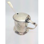 A Victorian sterling silver mustard pot with clear glass liner and fiddle pattern spoon London 1863.