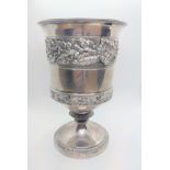 A George III sterling silver goblet, marks rubbed London 1818. Cast with continuous bands of oak