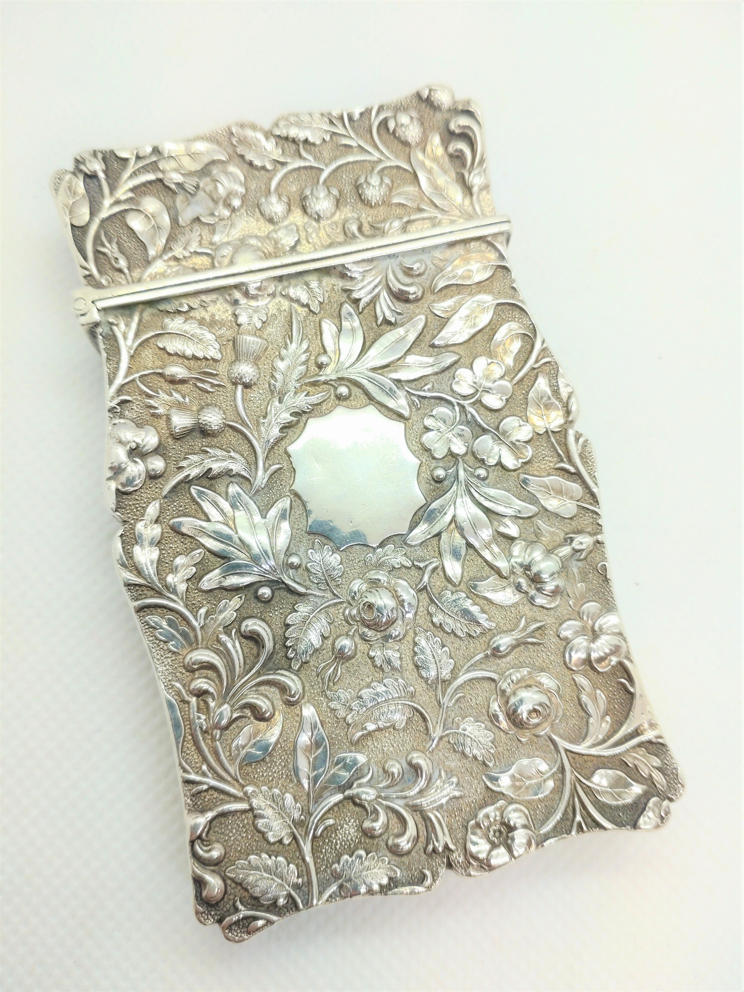 A sterling silver Victorian calling card case. Joseph Whilmore Birmingham 1846. Cast throughout with