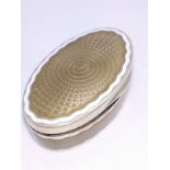A continental 1900 standard silver and brown enamel patch box. 6cm wide.
