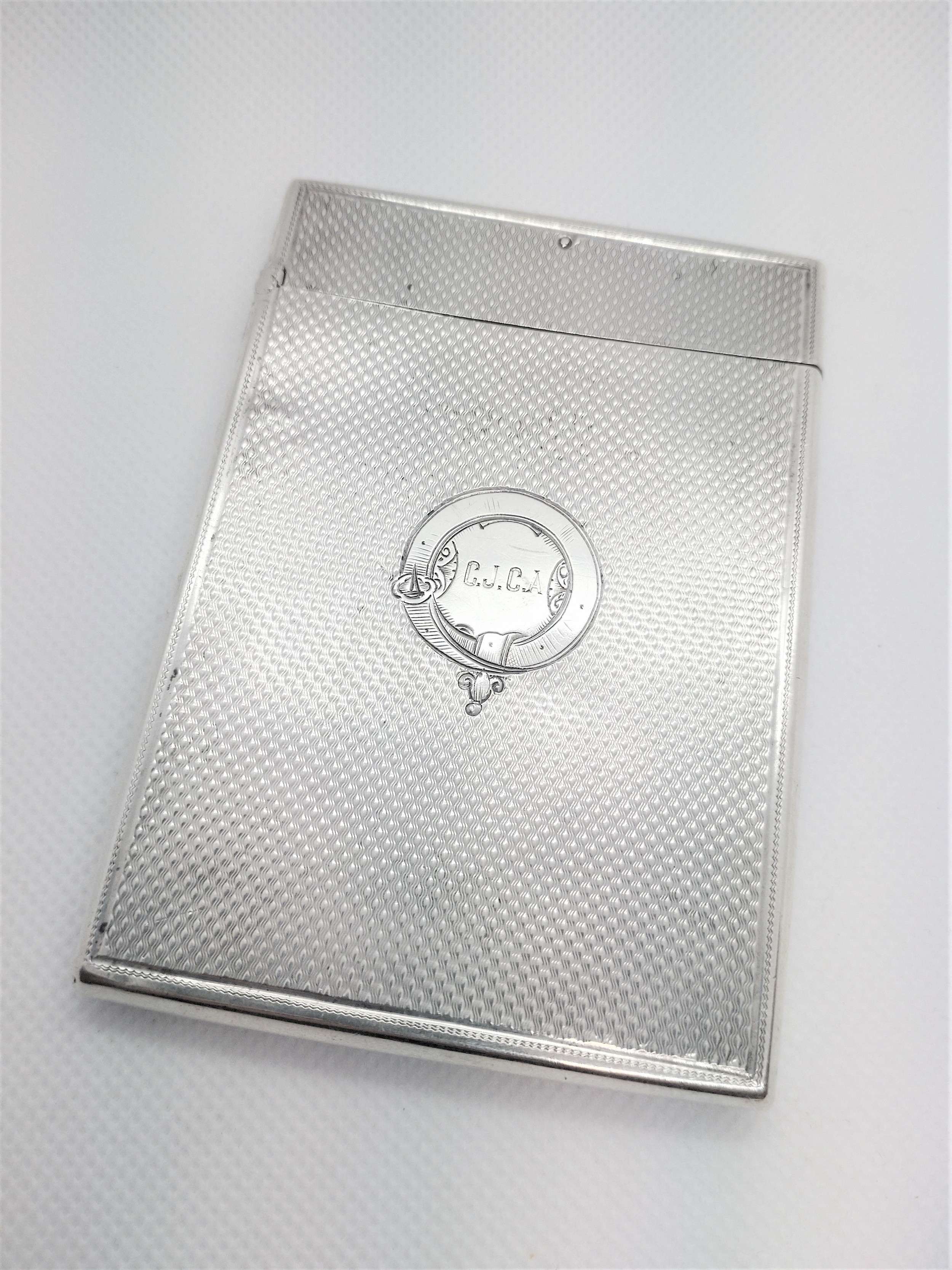 A Victorian sterling silver calling card case. Birmingham 1860. Engraved with initials. 62gms.