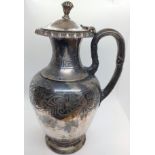 A Victorian sterling silver jug. London 1859. With Grecian design borders. Pomegranate finials. 21cm