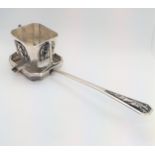 A Chinese silver coloured metal tea strainer. Circa 1900. 90.6gms.