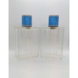A pair of cut glass silver gilt and blue enamel scent bottles. Early 20th century. 13cm high.
