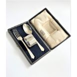 A Sterling Silver Childs Christening set. Cased. Retailed by Harrods. Wakely and Wheeler London
