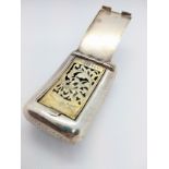 A George III sterling silver vinaigrette London 1817, shaped to fit the pocket. 6.5cm wide. 55.3gms.