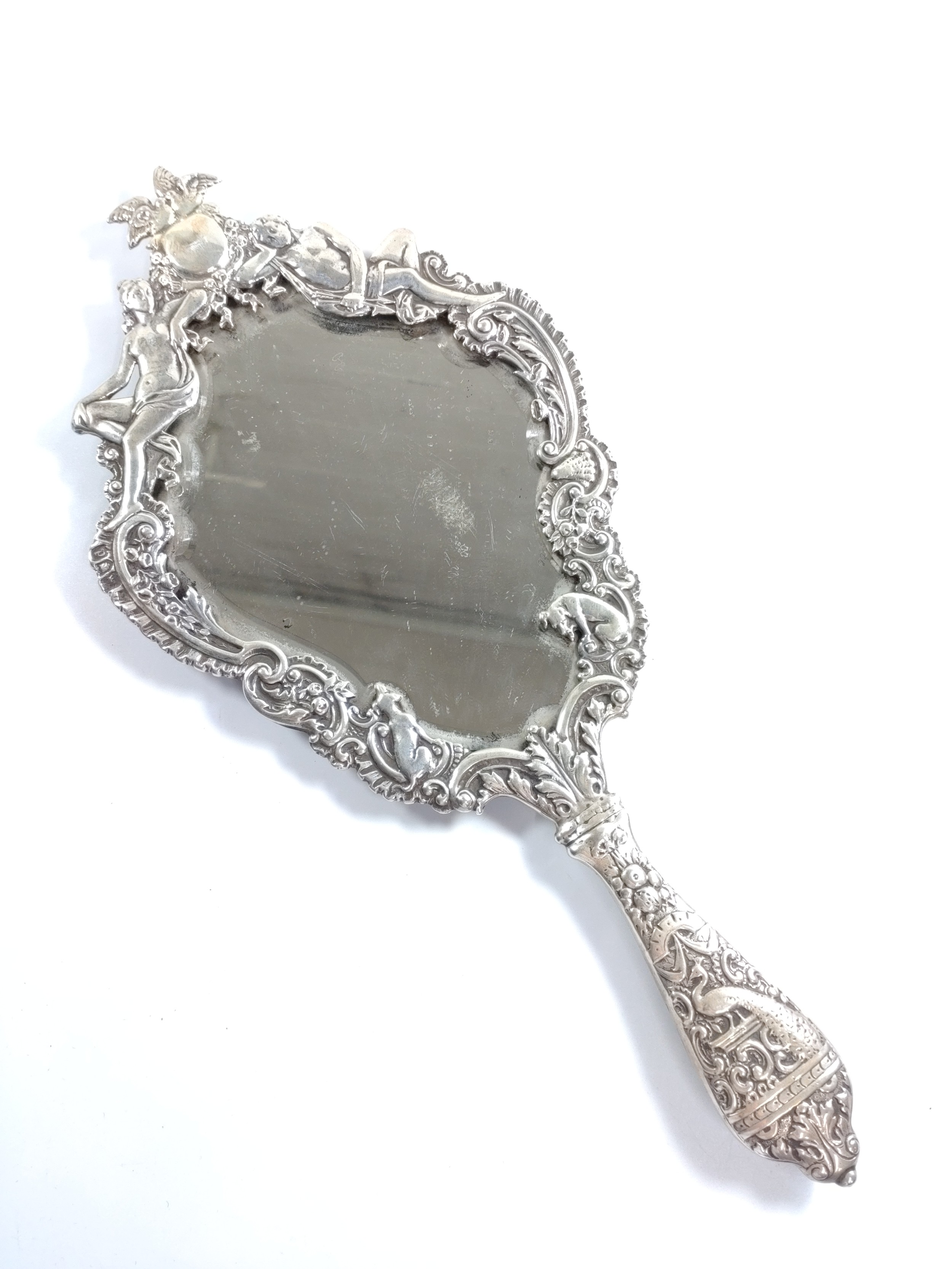 A sterling silver mounted hand mirror, London 1904.