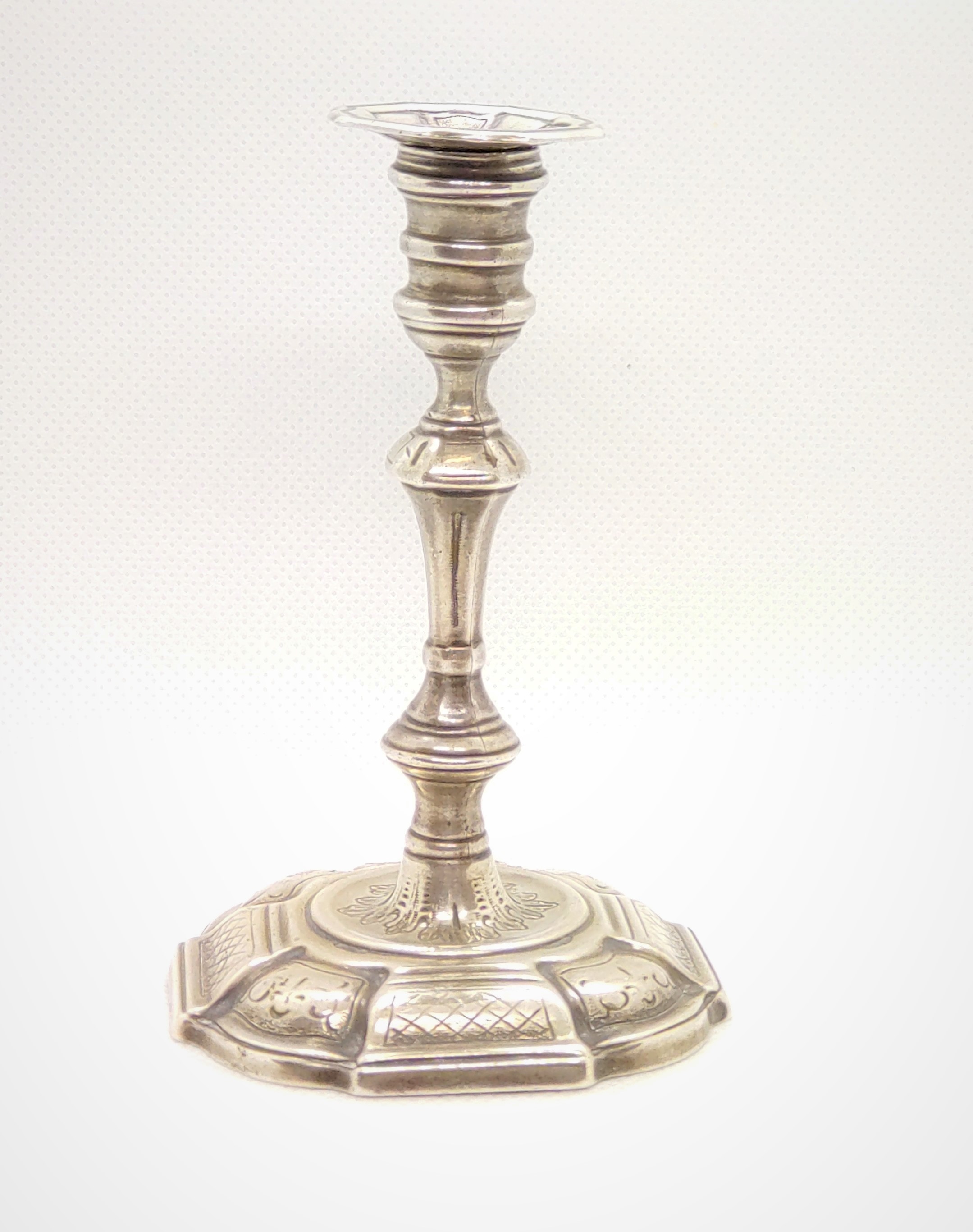 A Victorian sterling silver taper stick in Georgian style. London 1850. 11cm high. 115gms.