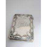 An Edwardian sterling silver card case by James Deakin & Sons, Birmingham 1902. With leather