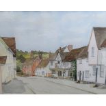 A watercolour of a village street.