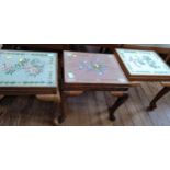 Three occasional tables with embroidered tops. 20th century.