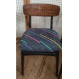 Four mid-century dining chairs, reupholstered with 80's design fabric.