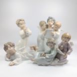 Four Lladro angel figure groups 8cm to 16cm high, one wing with glue repair (4)