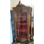 A French Vitrine. In 18th century style. 20th century. With red velvet interior and three shelves.