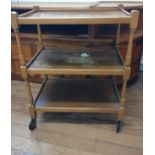 A 1960's stained wood tea trolley. 74 x 60 x 37cm.