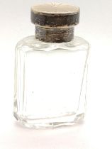 A silver and enamel scent bottle complete with stopper. 6.5sm high.