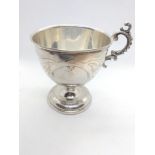 A Continental mug 19th century, probably 800 silver standard, possibly French. 10cm high. 98gms.