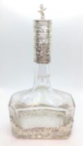 Large continental chased silver and glass scent bottle with stopper. Circa 1900.