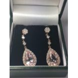 A pair of 18ct rose gold pear shaped morganite and Round Brilliant Cut diamond drop earrings, boxed,