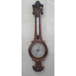 An Oak Mercury barometer. Circa 1880. With thermometer.