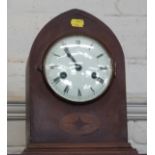 A mantel clock in a brown wooden case with chimes. (Key inside case)