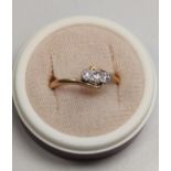 A diamond Ring. Set in 18 carat yellow gold and platinum. Size 0 and a half. 2.5 grams.
