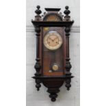 A Vienna Clock circa 1890. of typical form. With a pendulum.