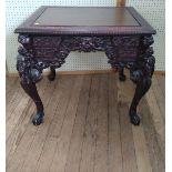 A Chinese centre table. Vintage. heavily carved throughout. 20th century. 78 x 86 x 70cm.