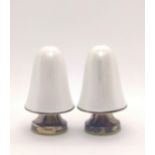 A pair of Norwegian silver and white enamel condiments. 6.5cm high.