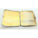 A sterling silver cigarette case with gold pique decoration, apparently unmarked. 8.5cm wide.
