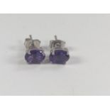 A pair of Amethyst studs in silver.