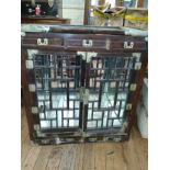 A Chinese rosewood fretwork mirrored cabinet. 96 x 89 x 44cm