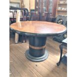A large Art deco Style Circular Table. Circa 1970. Supported on a large cylindrical column with