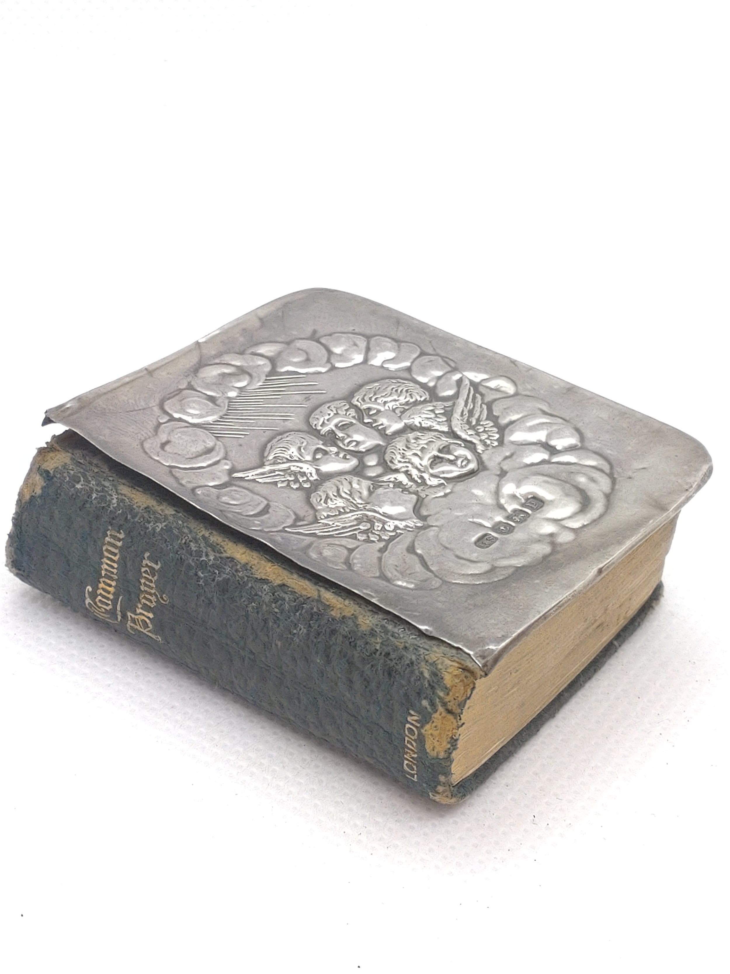 A Birmingham silver common prayer book cherubs.