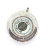 A sterling silver desk aneroid barometer. Chester 1916. 8.5cm diameter.