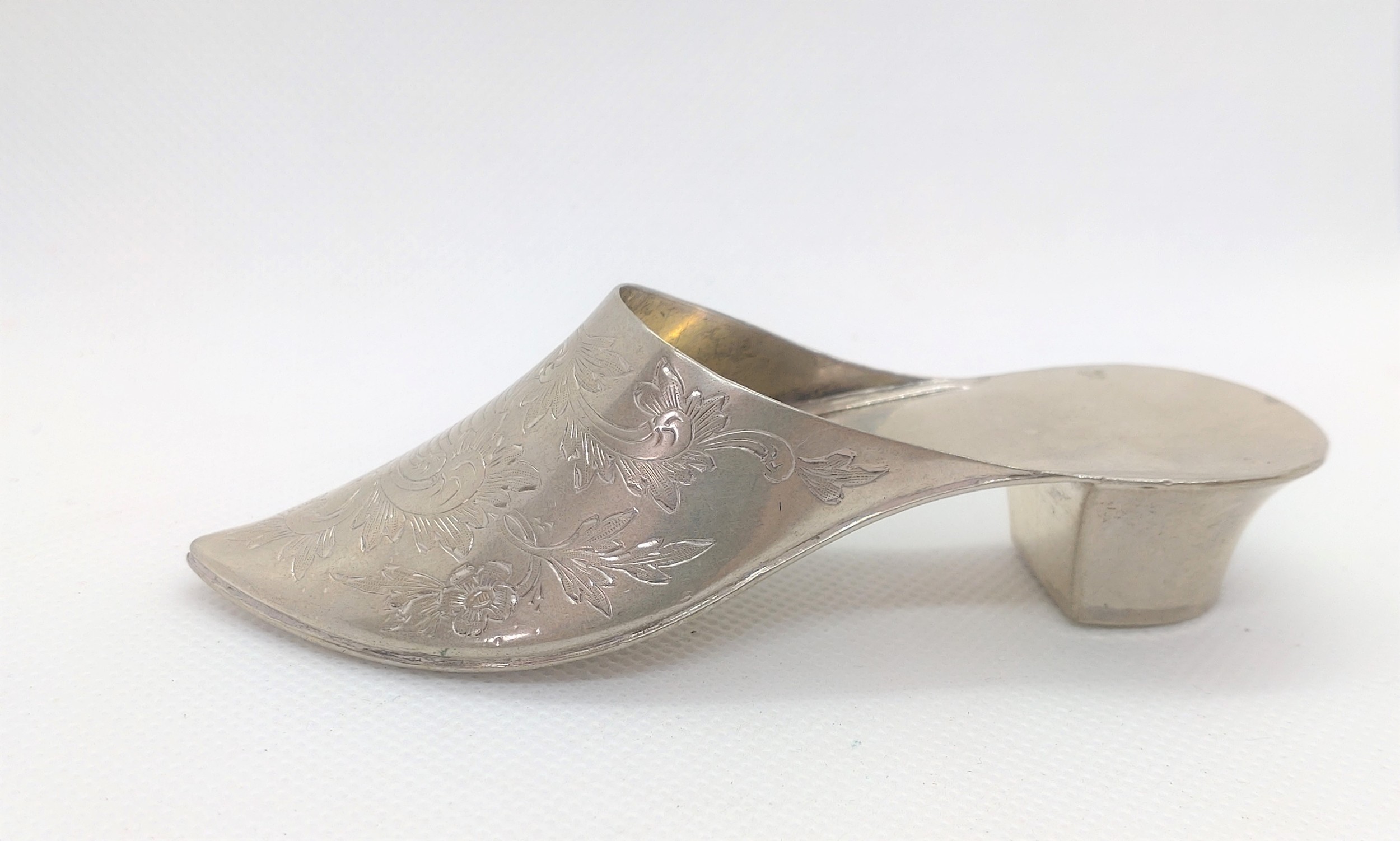 A Continental French import marked engraved shoe. Circa 1900