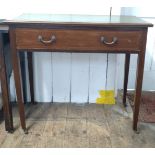 A Victorian writing desk. With inset leather top and fitted with a single frieze drawer. On casters.