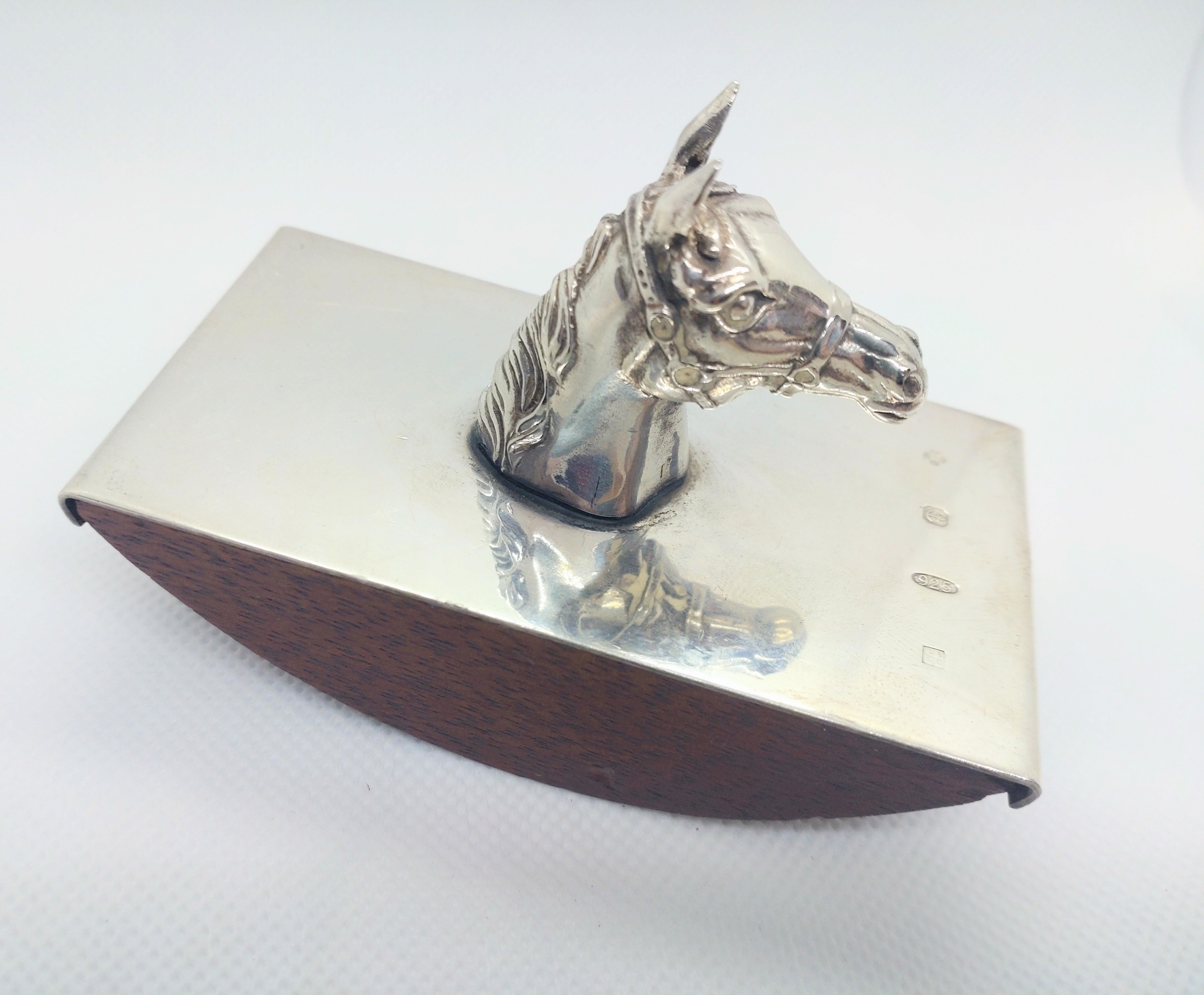 A modern silver mounted ink blotter decorated with a cast horse's head.